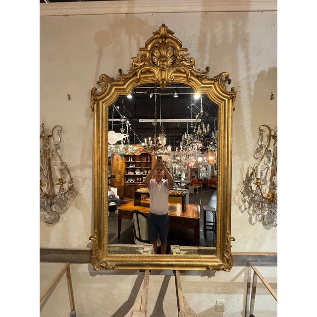 The 19th c. French Louis XVI Giltwood Mirror is a elegant and luxurious piece of home décor. Featuring intricate giltwood...