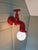 Vintage red ceramic wall light, in the shape of a faucet, produced by the German manufacturer Steinebach Leuchten in the...