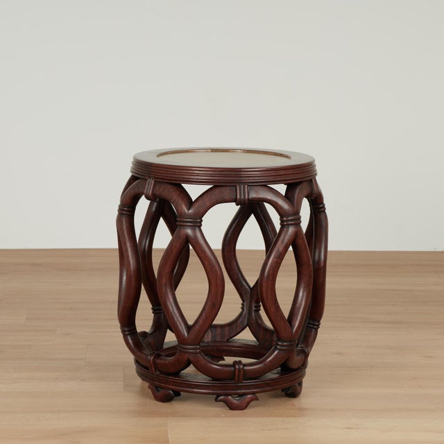 Standout pair of mid century Chinese stands hand carved in mahogany with painted faux stone inset tops.