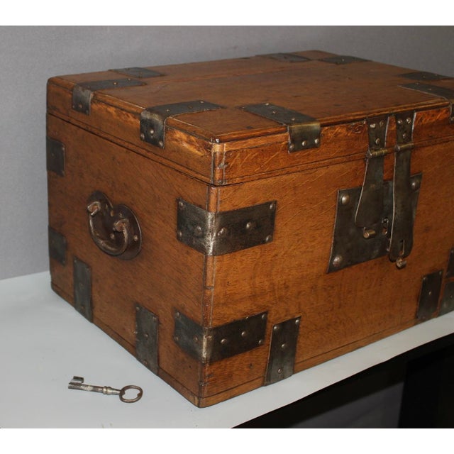 Oak chest with iron hoops, lock with key, waxed finish, interior is compartmentalized, 18th century, overall in very good...