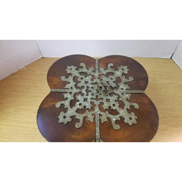 Solid wood with heavy patinaed brass accents. Quatrefoil design and brass accents at each corner of the box as well as a...