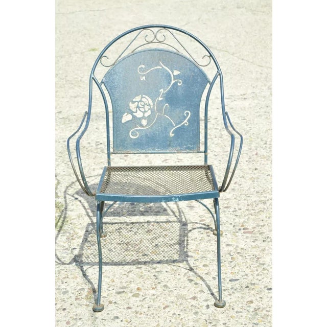Vintage Mid Century Wrought Iron Pierced Rose Garden Patio Dining Arm Chair. Item features a pierced rose design to...