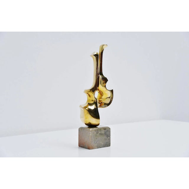 Abstract modern sculpture in bronze by Hattakitkosol Somchai (Bangkok, 1934-2000). This fantastic shaped sculpture has the...