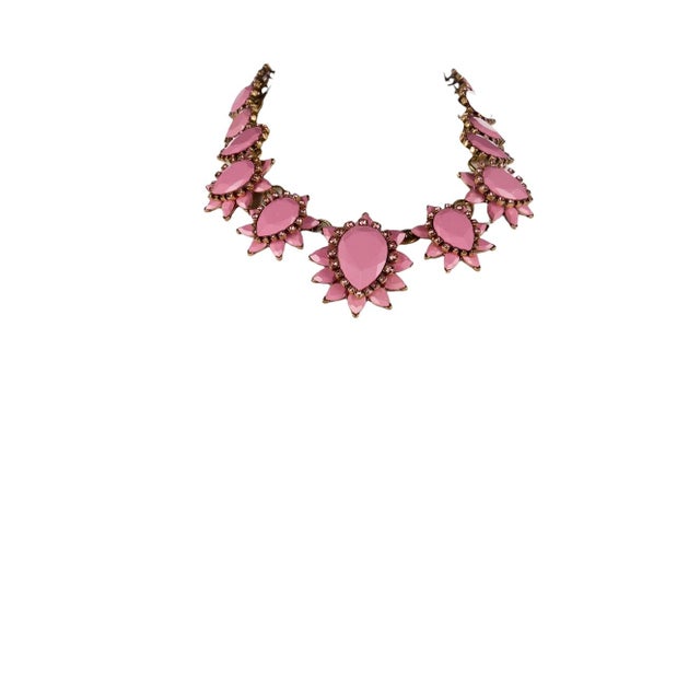 A bold pear shaped faceted resin in Starburst design with crystal accents in pink by the late designer. Be berry beautiful...