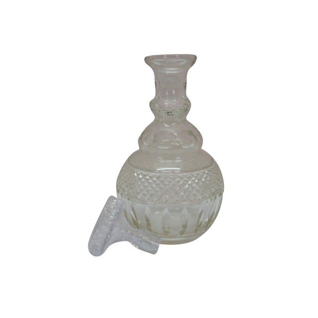 Vintage American Brilliant cut and faceted liquor decanter featuring a distinctive thumbprint design. Dimensions: 5.25" x...