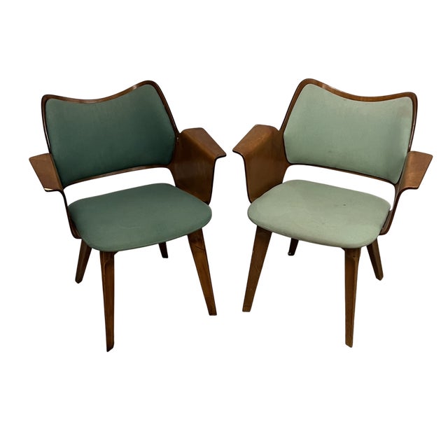 Pair of bent wood chairs that would look great in a small seating area or an office Very sleek lines Attributed to the...