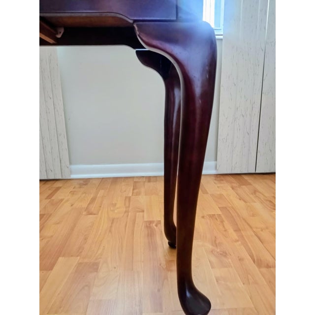 Writing Desk with two drawers and elegant turned legs. The tabletop is protected by 0.25-inch glass. Crafted from wood...