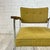 Mid Century Modern Robert John Stainless Steel Armchair. The armchair features a walnut padded armrest and polished...