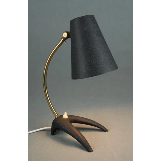 A rare model b52 table lamp designed by erik wärnå and produced by ewå värnamo, sweden, during the 1950s. Combining...