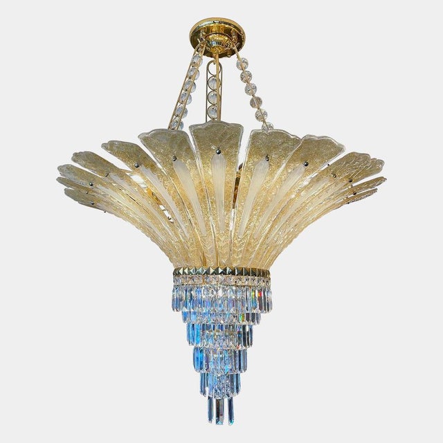 A very large flamboyant Murano palm leaf chandelier. The gilt frame supporting the 24 Carat gold flecked Murano glass...