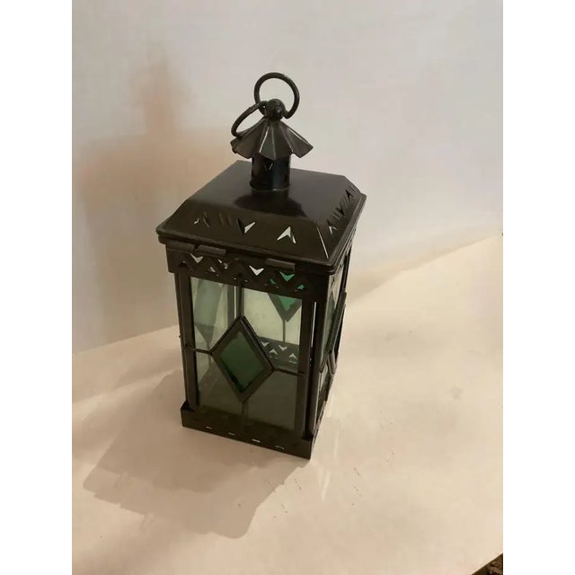 This listing features a small brass pendant with clear glass and tinted green glass