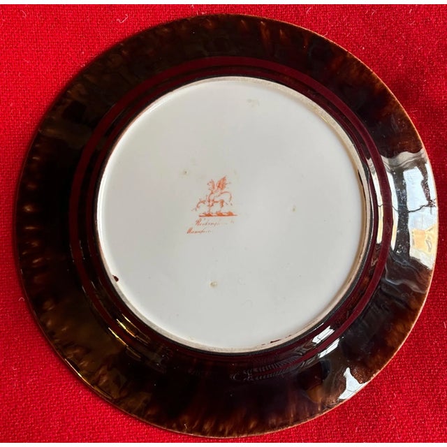 Antique 19th century Rockingham porcelain plate with brown treacle tortoise glaze on the back rim. Red mark period 1820's....