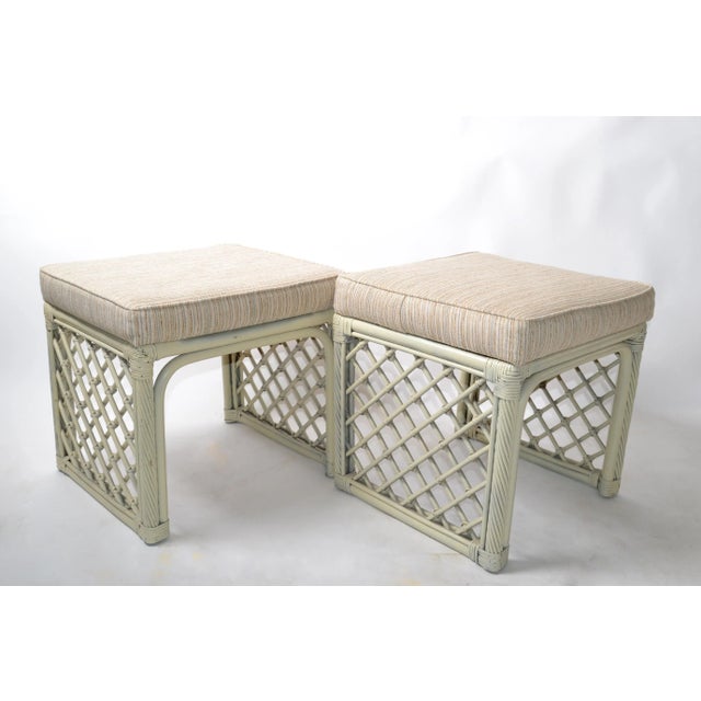 A pair of vintage olive green bamboo and rattan stools or benches made by Vogue Rattan. Original striped Linen Fabric....