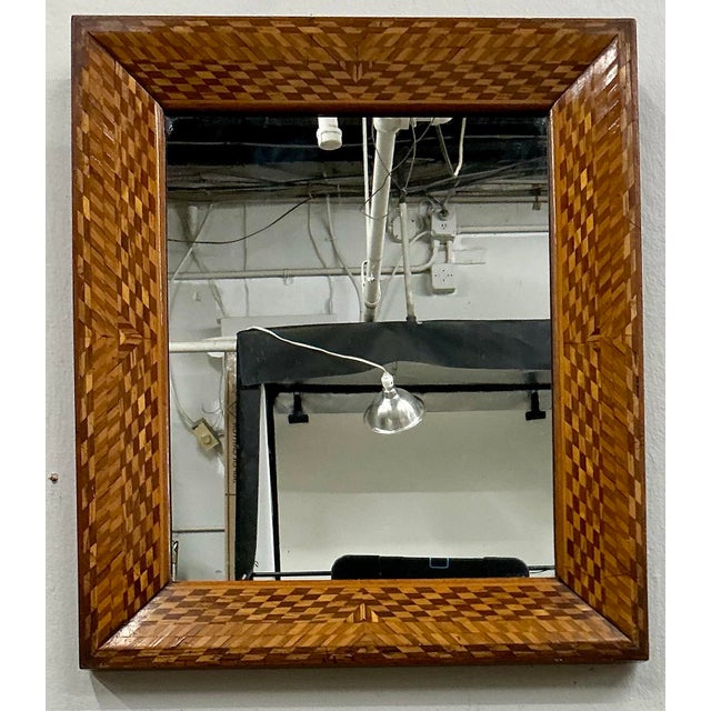 Wonderful little mirror with intricately inlaid frame. Can be used on the wall at ont the easel as a dressing mirror.