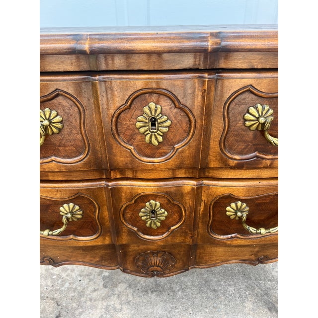 Elegant 19th-century Louis XV style commode featuring a beautifully shaped serpentine front, graceful cabriole legs, and...