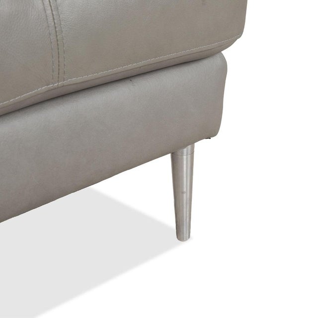 The Gutmann Factory leather stool in gray impresses with its modern design, high-quality materials, and elegant...