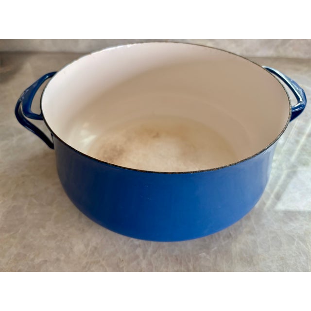This Dansk pot is a very useful size. It measures 10" in diameter (not including the handles), with handles it measures...