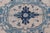 This unique vintage Oushak from Turkey displays cream/ivory background with variety of blue colors on a medallion design....