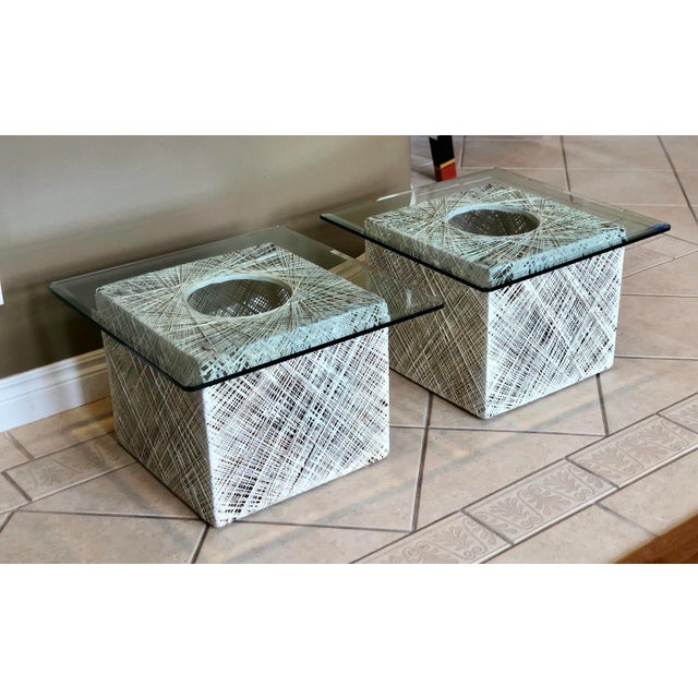 We are pleased to offer a pair of fabulous, modern Russell Woodard spun fiberglass square side tables, circa the 1970s....