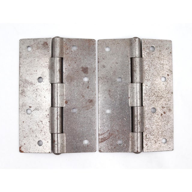 These Stanley door hinges are made of steel with flat tips, five knuckles, and a staggered hole pattern. The original...