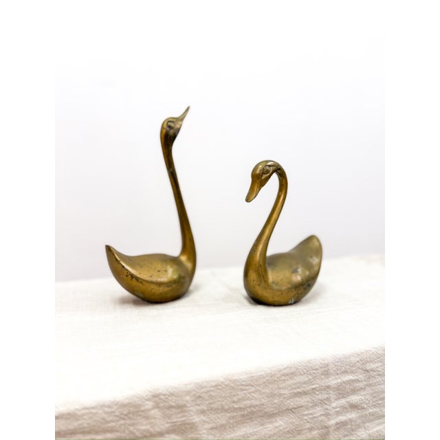 Add timeless elegance to your home with this charming set of vintage brass swan figurines. Perfect for a mantel,...