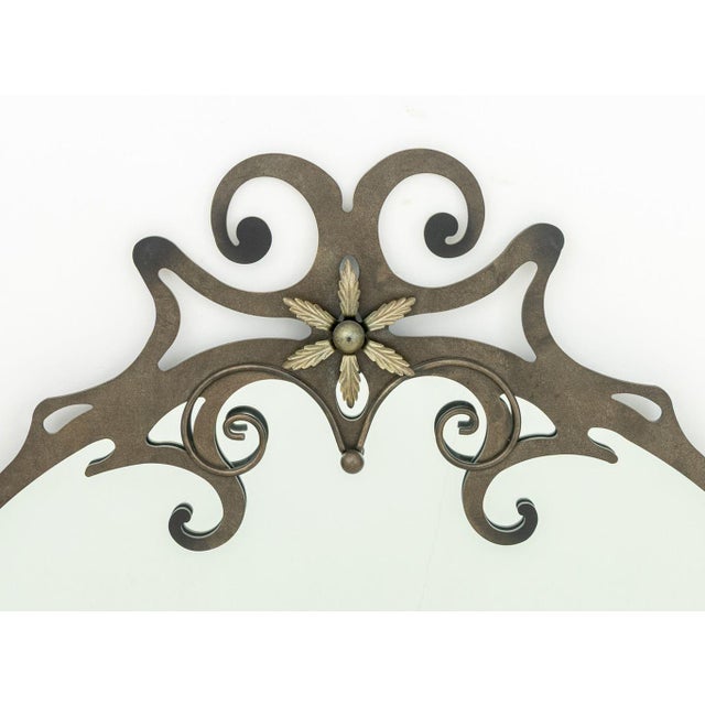 Art Nouveau Style Wrought Iron Circular Mirror, the pierced scroll form crest with ball form and floral appliques. 42" H x...