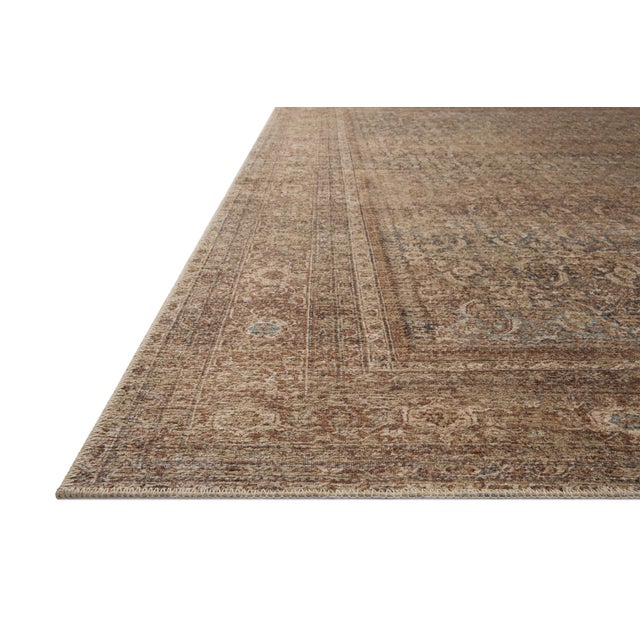 The Cambria Collection is a beautifully executed vintage-style area rug from Amber Lewis x Loloi with a blended jute and...