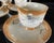 This is a beautiful set of hand painted lusterware. It is a tea set that includes a lidded teapot with six diminutive...