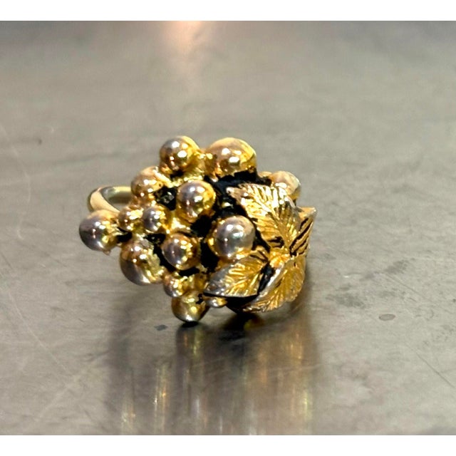 1960s Sarah Coventry adjustable gold tone grape bunch ring. Excellent condition.