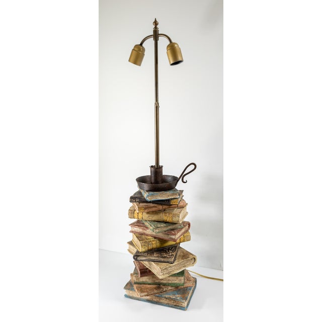 We are selling this great looking mid-century carved wood table lamp with attractive worn book messy stack form. Probably...