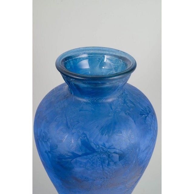 European art glass, floor vase. Large free-blown floor vase in blue art glass with a dynamic, cloud-like internal...