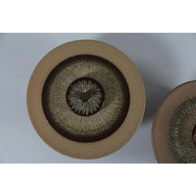 Pair of stylish Danish mid-century wall sconces. The wall lamps are made by the acknowledged pottery Søholm on Bornholm...