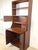 This is the kind of piece that makes a room do more with less — a beautifully designed mid-century modern secretary...