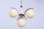 This four-light chandelier is an exclusive example of early 20th-century Czechoslovak design, harmoniously blending the...