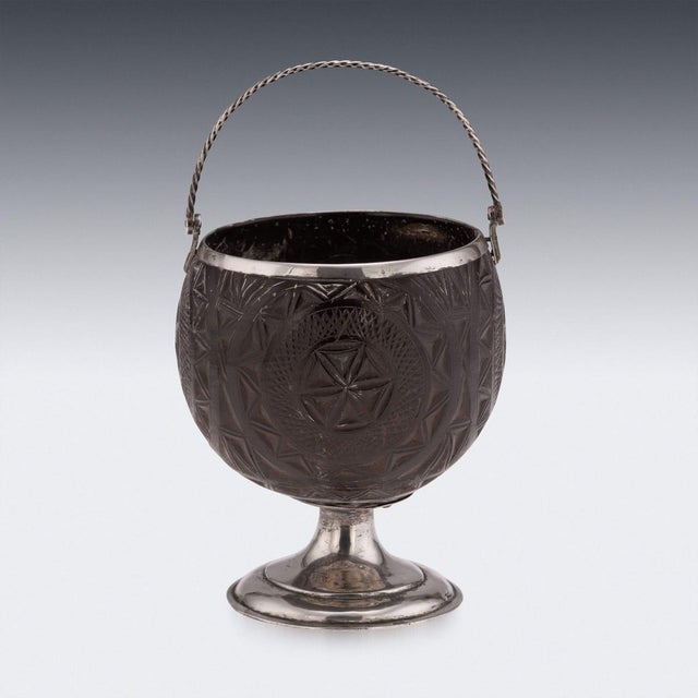 A fine and characterful georgian english coconut cup, mounted in silver and dating to the late 18th to early 19th century....