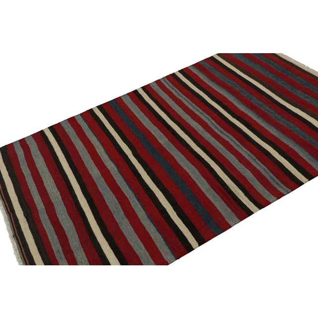 Hand-knotted in wool, this 4x6 Afghan tribal kilim represents a new line of tribal carpets in the Modern Classics...
