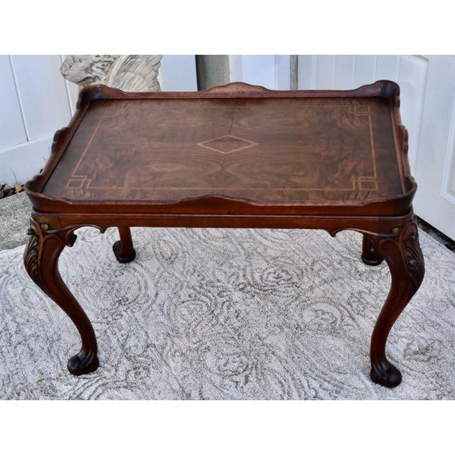 Antique (1920's) Accent Table has a French Style. The Wood is Walnut. Carved and Inlaid. The Meaurements: 30"W x 20"D x 19"H.