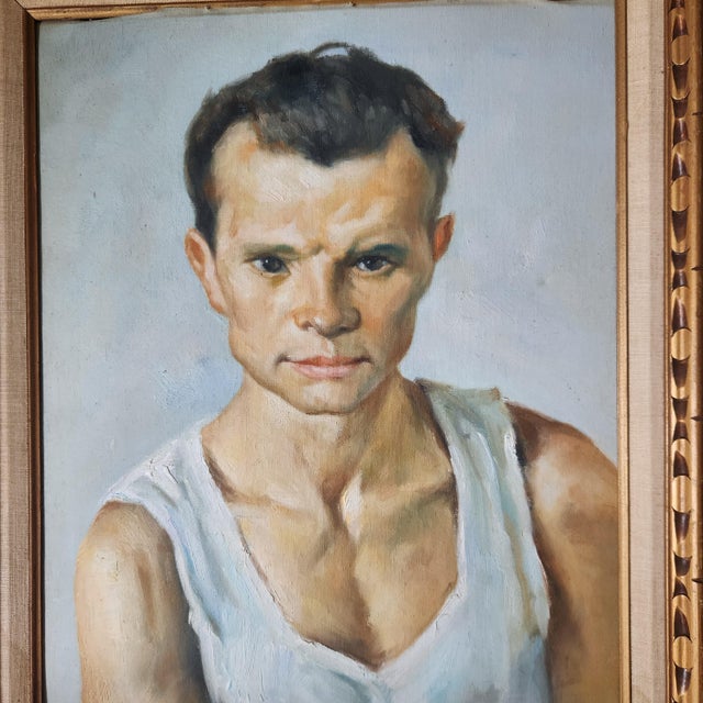 An oil on canvas portrait of a handsome muscular man. Original frame. Unsigned