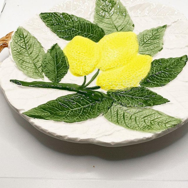 A small round majolica ceramic lemon plate. This plate will be great displayed on a wall or used at your next party to...