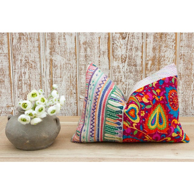 These colorful throw pillows are made from Rabari tribal dowry bags. The embroidery is on cotton and has intricate chain...