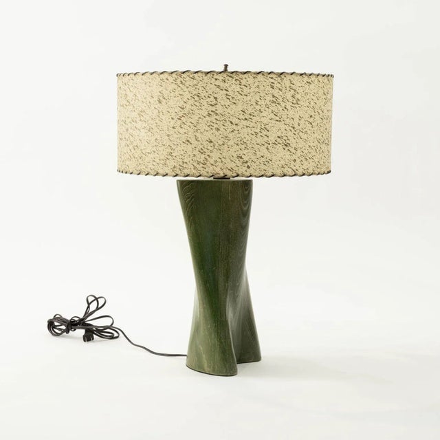 Modern green-dyed carved wood table lamp circa 1960-1979. Wired for use within the USA and includes shallow drum shade...