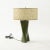 Modern green-dyed carved wood table lamp circa 1960-1979. Wired for use within the USA and includes shallow drum shade...