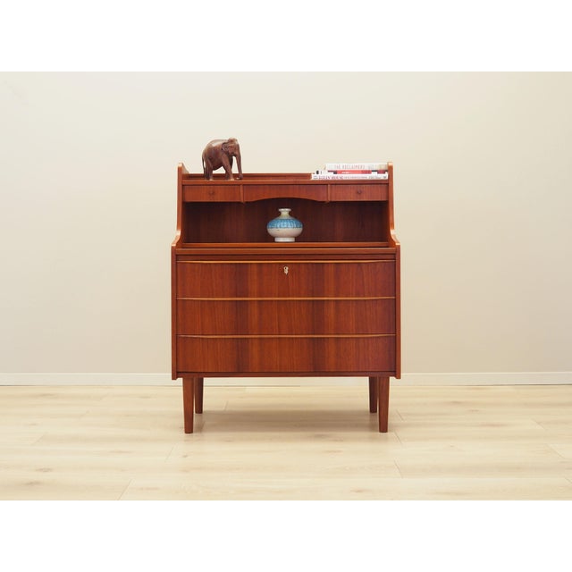 The secretary was made in the 1970s, Danish production. The structure is covered with teak veneer. The legs are made of...