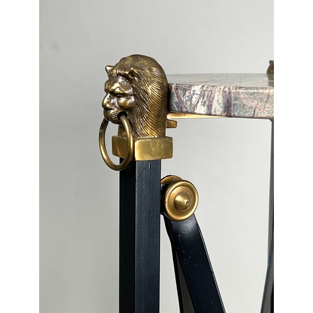 This elegant vintage Maison Jansen–style sculpture stand features a round marble top supported by a refined gilt-accented...