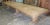 This giant trestle table is made in vintage, 4" thick white oak. The top separates into two halves by pulling out four...
