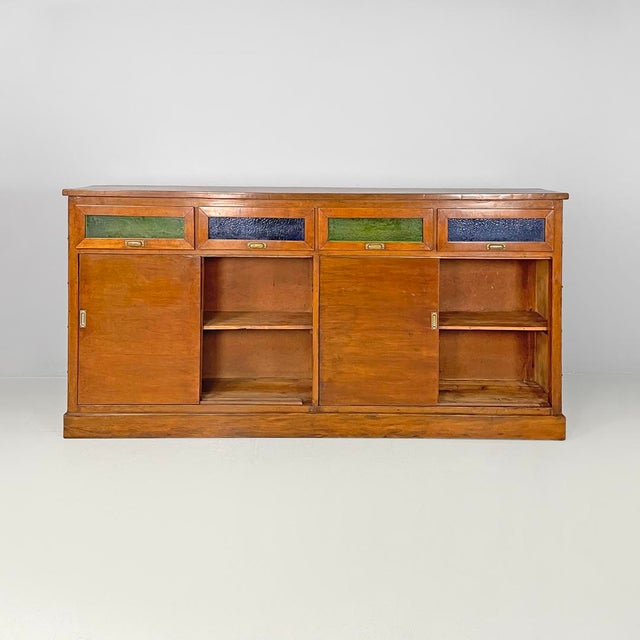Italian Art Deco wooden sideboard with green and blue stained glass, 1930s Sideboard or wooden storage cabinet. Under the...
