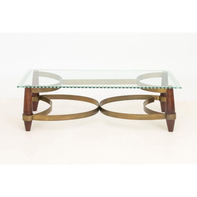 Hollywood Regency Style Brass and Wood Coffee Table, the rectangular glass top with frosted glass details. 16.25" H x 55"...