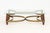 Hollywood Regency Style Brass and Wood Coffee Table, the rectangular glass top with frosted glass details. 16.25" H x 55"...