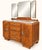 A 1930s art deco dressing table in solid oak with a pronounced grain, featuring the wide, squat silhouette characteristic...