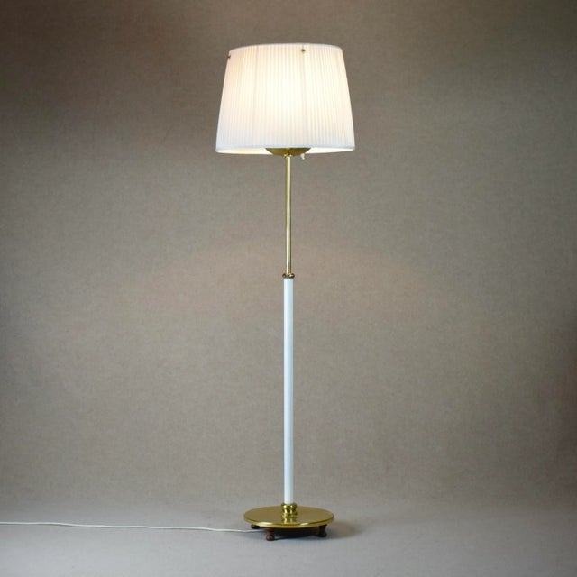 Josef Frank classic floor lamp model nr 2564. with rare pleated satin textile shade, Stem is white lacquered on the bottom...